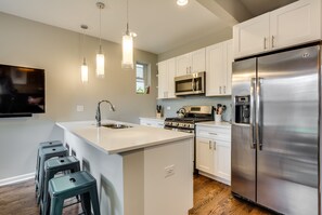 Bar seating for four at the kitchen counter