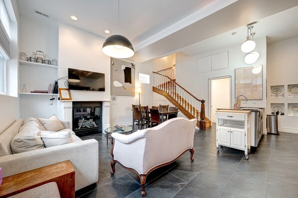 When you walk in, you're greeted with an open living space, including a beautiful kitchen and heated floors