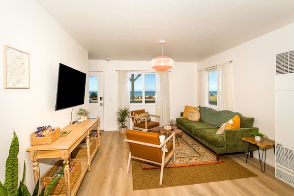 Take in beautiful ocean view while relaxing in a living area 