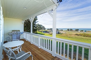 Front porch is equipped with barbeque