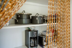 Plenty of cookware and essentials for easy meal prep.