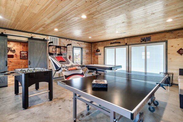 A separate game room and theater room. Variety of fun things to do are available in this space for family and friends fun!