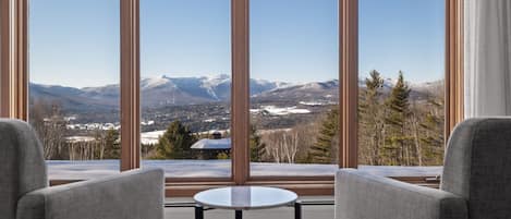 Enjoy the amazing view of Mt. Mansfield from the cozy chairs in the living room.