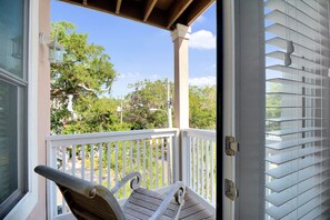 Private Balcony – Rocking Chairs & Tree-Lined Views - Step onto your private balcony with peaceful rocking chairs and leafy views—just off the king suite. This quiet corner of our St. Simons Island vacation rental is made for coffee at sunrise or wine at sunset.