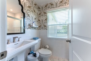 full bath with tub/ shower combination. towels, soaps and hairdryer provided