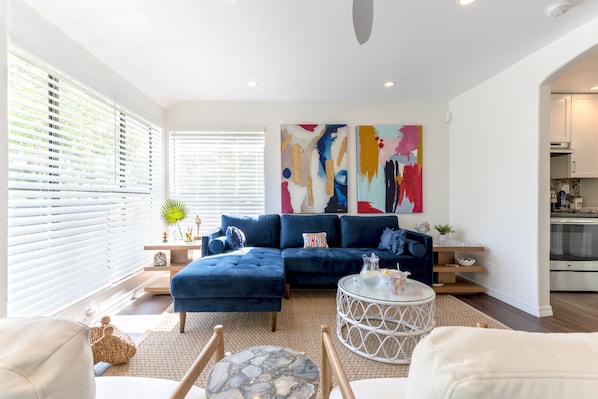 spacious living room with tv and lots of natural light. fast wifi speeds