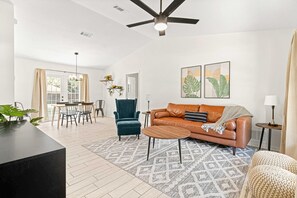 Enter into the living, dining space with vaulted ceilings 