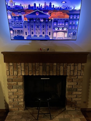Fire place (not to be used) and 55” smart TV