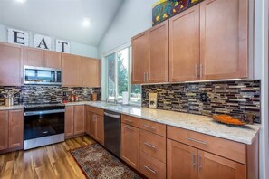 The kitchen has plenty of counter space and enough room to cook comfortably