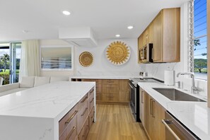 G106 Kitchen Maui Eldorado - California Coastal Kitchen with custom oak cabinetry and stainless appliances.