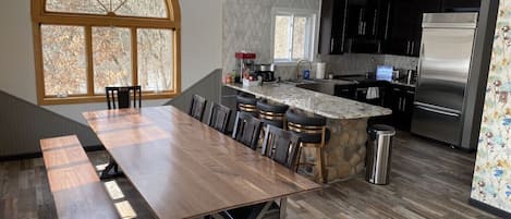 Chef's kitchen with 10' custom walnut table