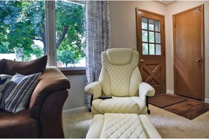 Vibrating massage chair in living room.
