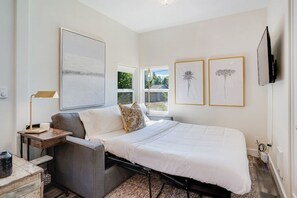 The sofa converts to a queen sleeper to accommodate additional guests.