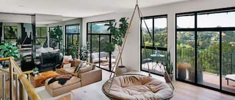 The elevated second living room with 4 person adult swing 