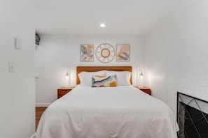 Bedroom with queen Helix mattress and luxurious Pima cotton sheets.