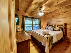 Main Floor Queen Bedroom with lake and layered mountain views