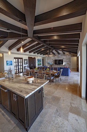 Open concept layout living and dining area with direct access to the pool area 