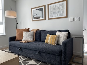 Comfy West Elm couch & designer accessories make this townhome stylish & modern.