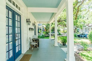 Look at that gorgeous 1905 front porch with a fire table available