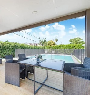 Patio with heated pool, playground, BBQ, pool table and outdoor furniture