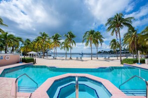 Communal pool and spa overlooking the beach. 