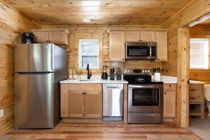 Kitchen Complete With Custom Wood Cabinets, Stainless Appliances, and Quartz Countertops!