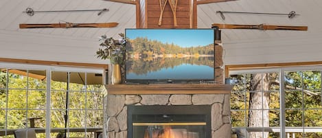 Living room features SmartTV and fireplace