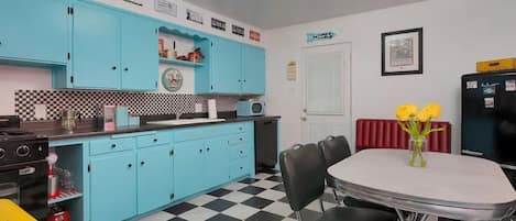 Full kitchen with stove, microwave, dishwasher. 