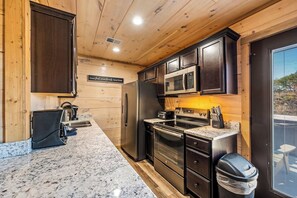 The modern kitchen is well-equipped and has both a drip and Keurig coffee maker.  You'll also find a small air fryer, a slow cooker, and a blender.