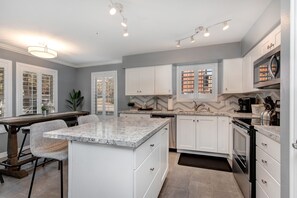 Sleek countertop with modern appliances, perfect for culinary creations.