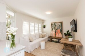 Large four seater sofa in beautofully styled lounge room-