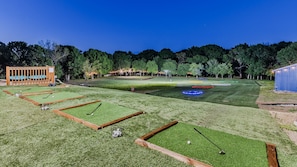 Mini top golf driving range, our softball field, and the top of our water slide