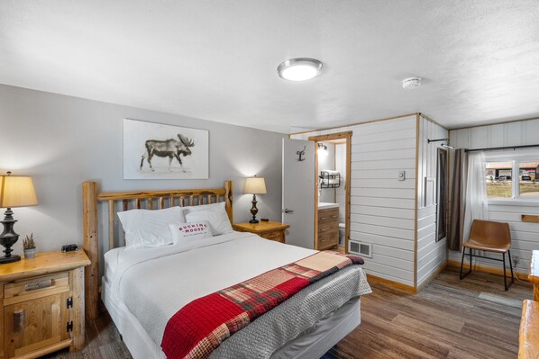 View of room from doorway. Queen Bed, Entrance to Bathroom