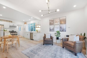 The front living space flows into a dining area and fully stocked kitchen