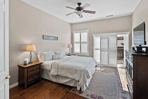 Upstairs King bedroom with TV, deck access and walk in closet.