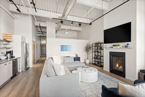 Another picture of the open loft style living room looking down the hallway.