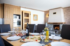 Prepare meals in the kitchen and enjoy them at the dining table.