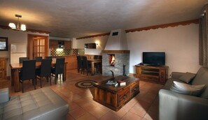 Warm up in front of your private fireplace in the cozy living room!
