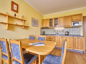 Furniture, Property, Cabinetry, Table, Wood, Chair, Interior Design, Flooring, Yellow, Floor