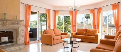 Couch, Property, Plant, Furniture, Window, Orange, Wood, Interior Design, Comfort, Houseplant