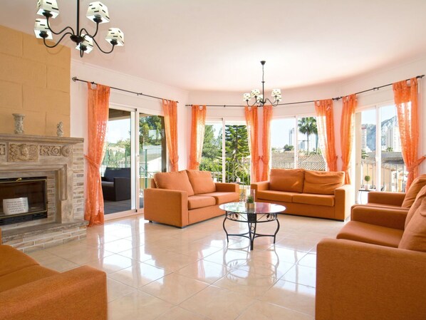 Couch, Property, Plant, Furniture, Window, Orange, Wood, Interior Design, Comfort, Houseplant