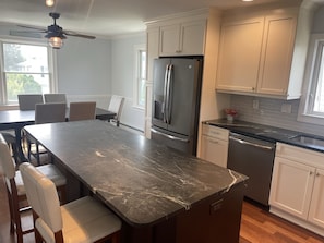 Large kitchen with dining table and six chairs