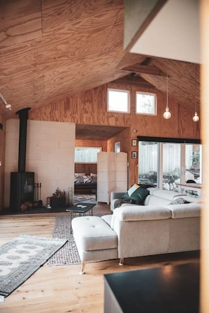 Arched wooden ceiling and fireplace.