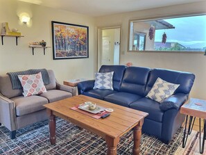 Comfortable living area with picture window letting in lots of natural light