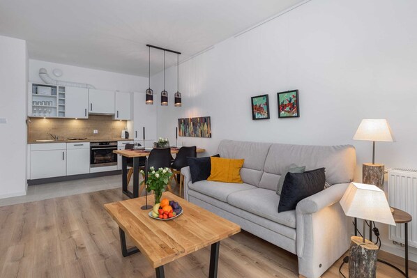A cozy living room with modern furniture and a warm ambiance.