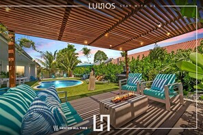 beautiful pool located in the backyard of this rental home.