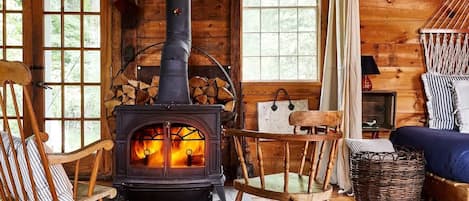 The wood-burning stove is the Barn's heart in the Winter.We provide all the wood