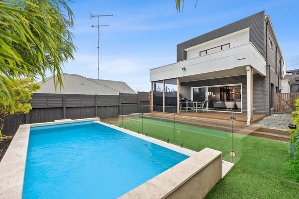 Enjoy the luxury of a solar-heated infinity flow-over pool, perfect for a refreshing dip after a day at the beach