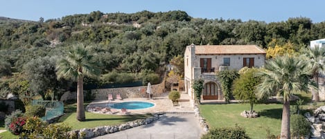 Hilltop villa exterior view, swimming pool