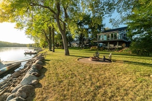 Backyard with fire pit and river views